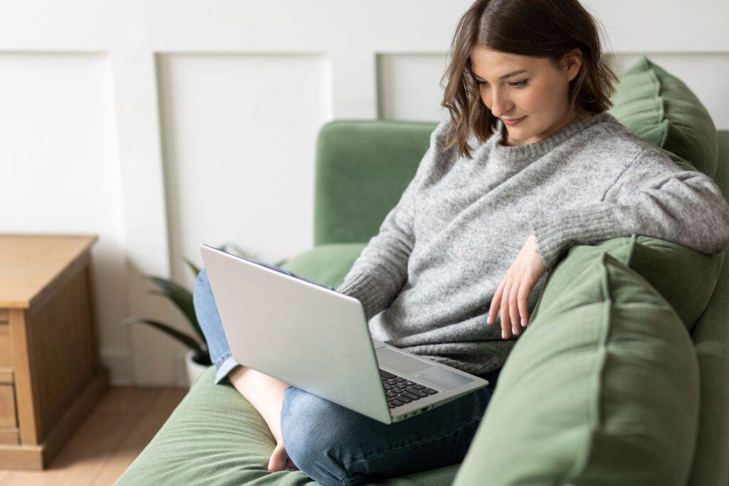 Woman working remotely on laptop exploring digital career opportunities